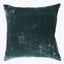 Dark teal velvet throw pillow with luxurious sheen and texture.