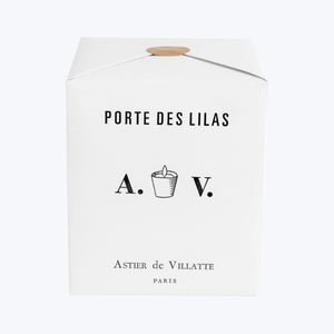 Elegant glass candle with Parisian-inspired label and floral design. - hover