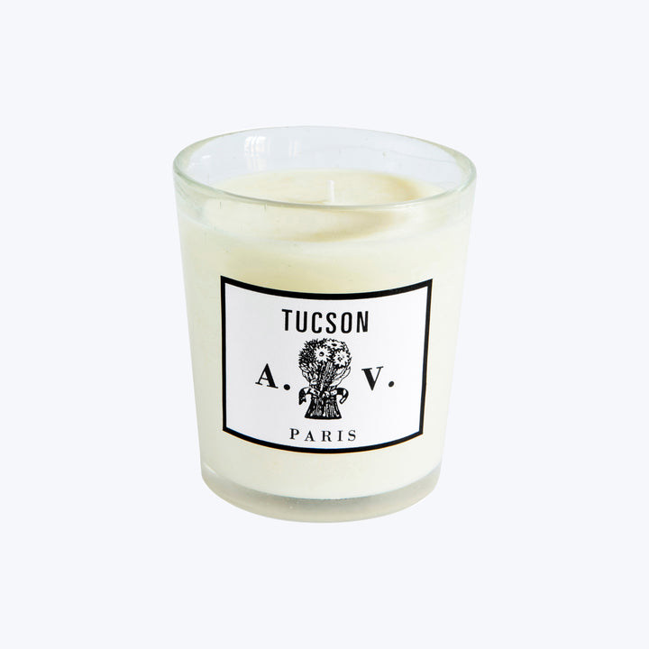 Unlit scented candle in glass container with TUCSON A.V. PARIS label.