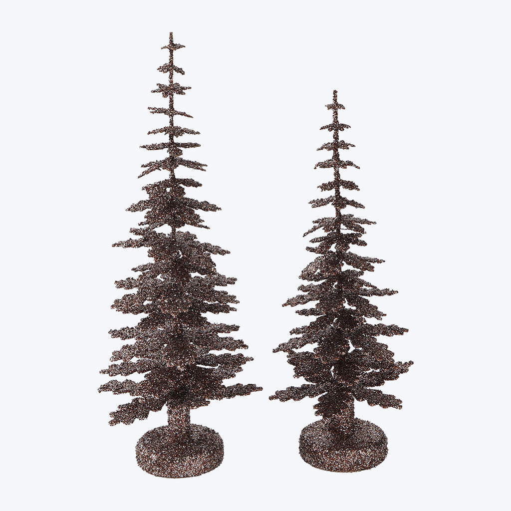 Two glittery artificial trees with snow-like finish on bases.