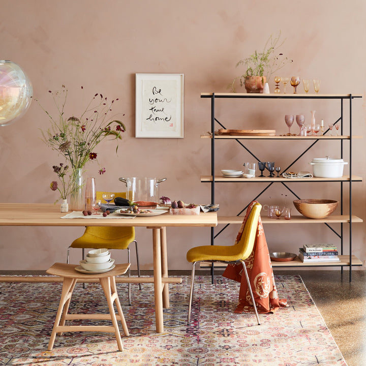 Modern and stylish dining area with curated kitchenware and inviting atmosphere.