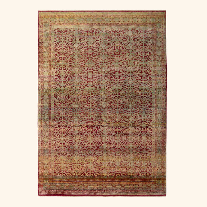 Hand-knotted oriental rug with intricate patterns in rich colors.