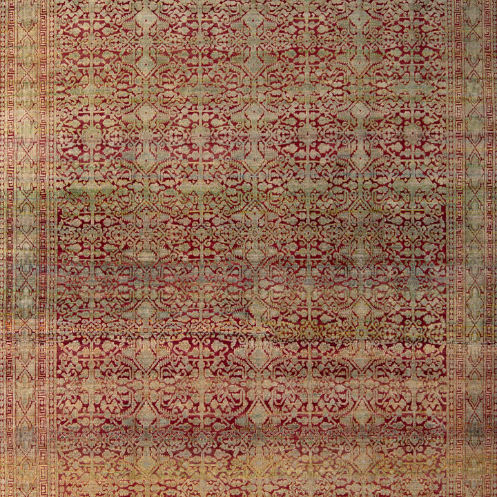 Intricately patterned vintage rug with floral and geometric motifs in rich colors.