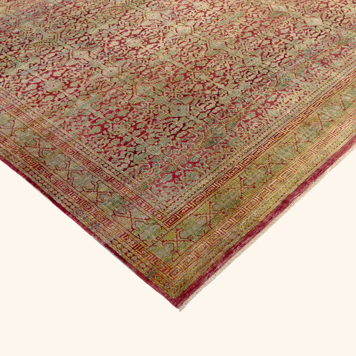Intricate Persian-style carpet with floral motifs in rich colors.