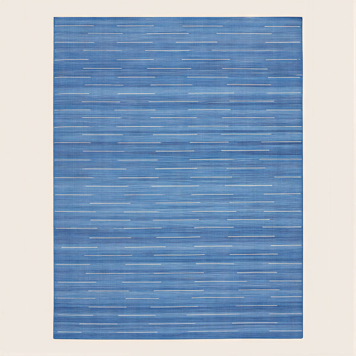 Modern blue area rug with textured layered appearance in flat image.