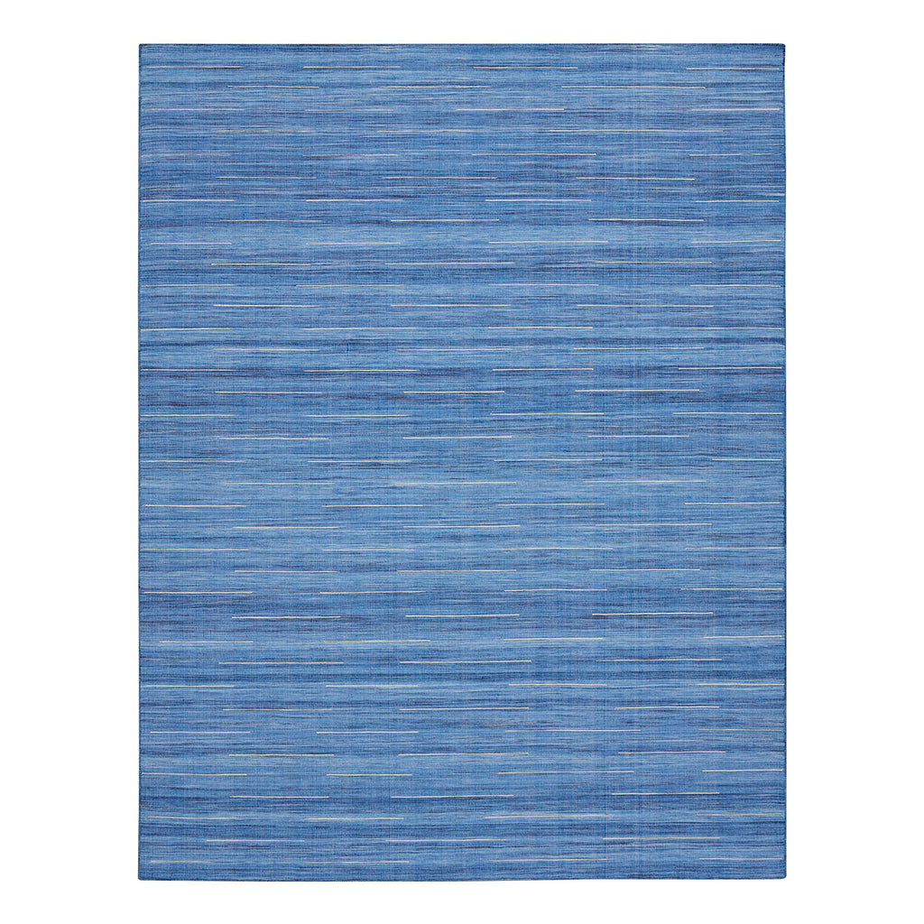 Modern blue area rug with textured layered appearance in flat image.