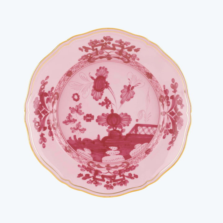 Vintage decorative plate with pink and red intricate design