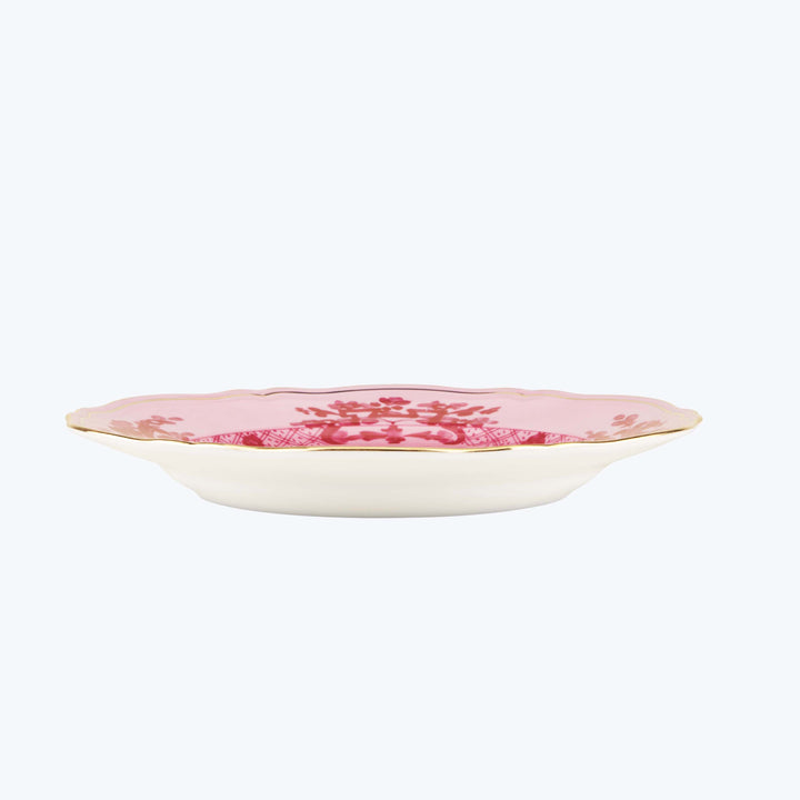 Elegant off-white plate with pink floral design and scalloped edge.