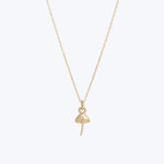 Gold Ankh necklace symbolizing life and immortality on white background.