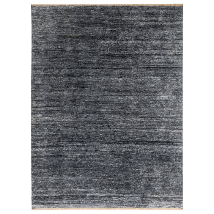 Gradient striped carpet with sheen and bound edges on display.