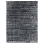 Gradient striped carpet with sheen and bound edges on display.