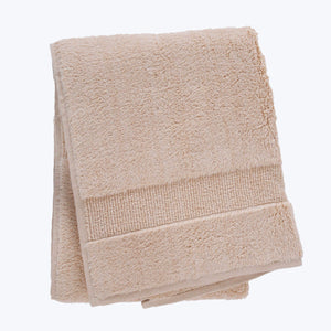Two soft and absorbent brown bath towels stacked neatly together. - hover