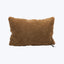 Rectangular plush pillow in light brown against white background tag