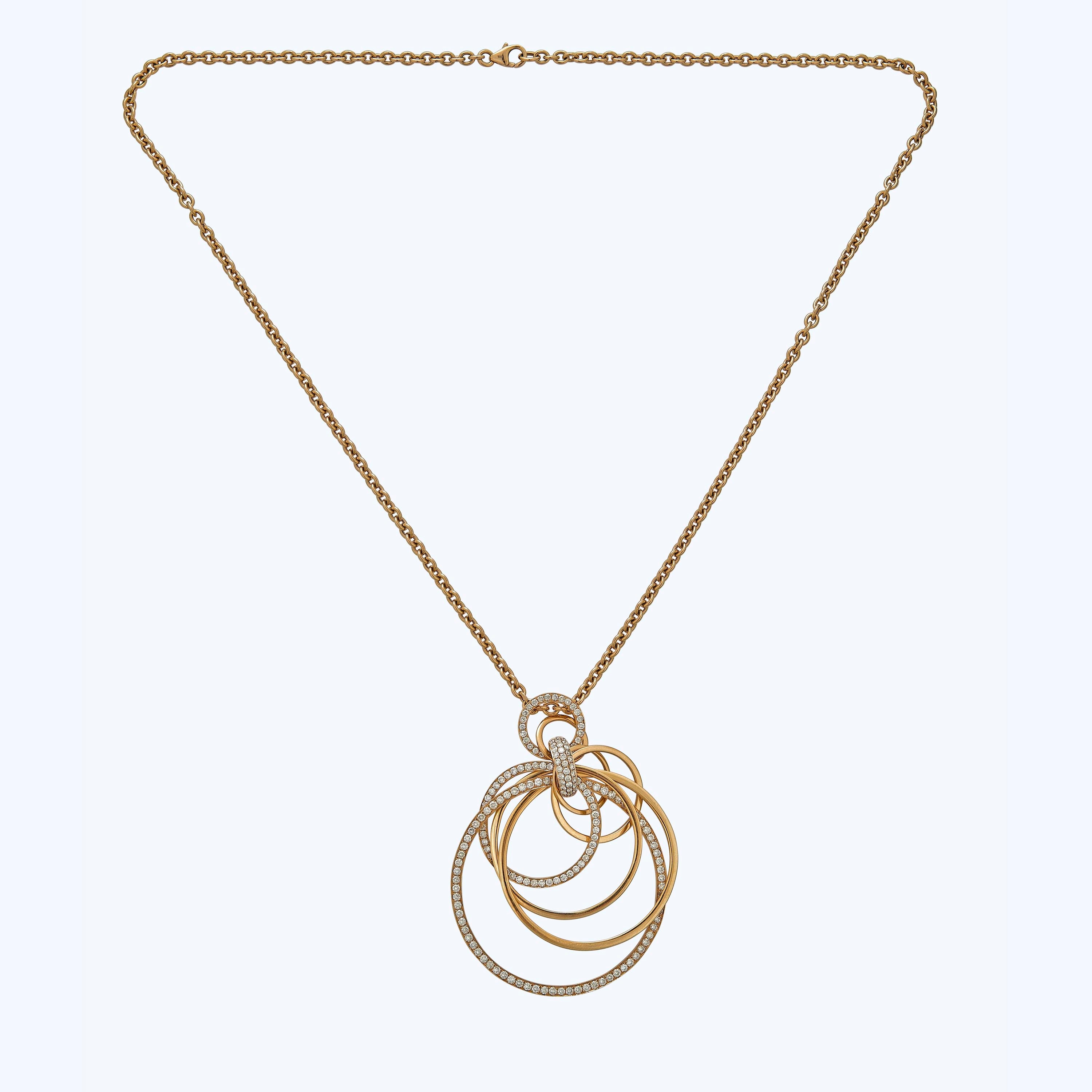 Gold and diamond interlocking rings pendant