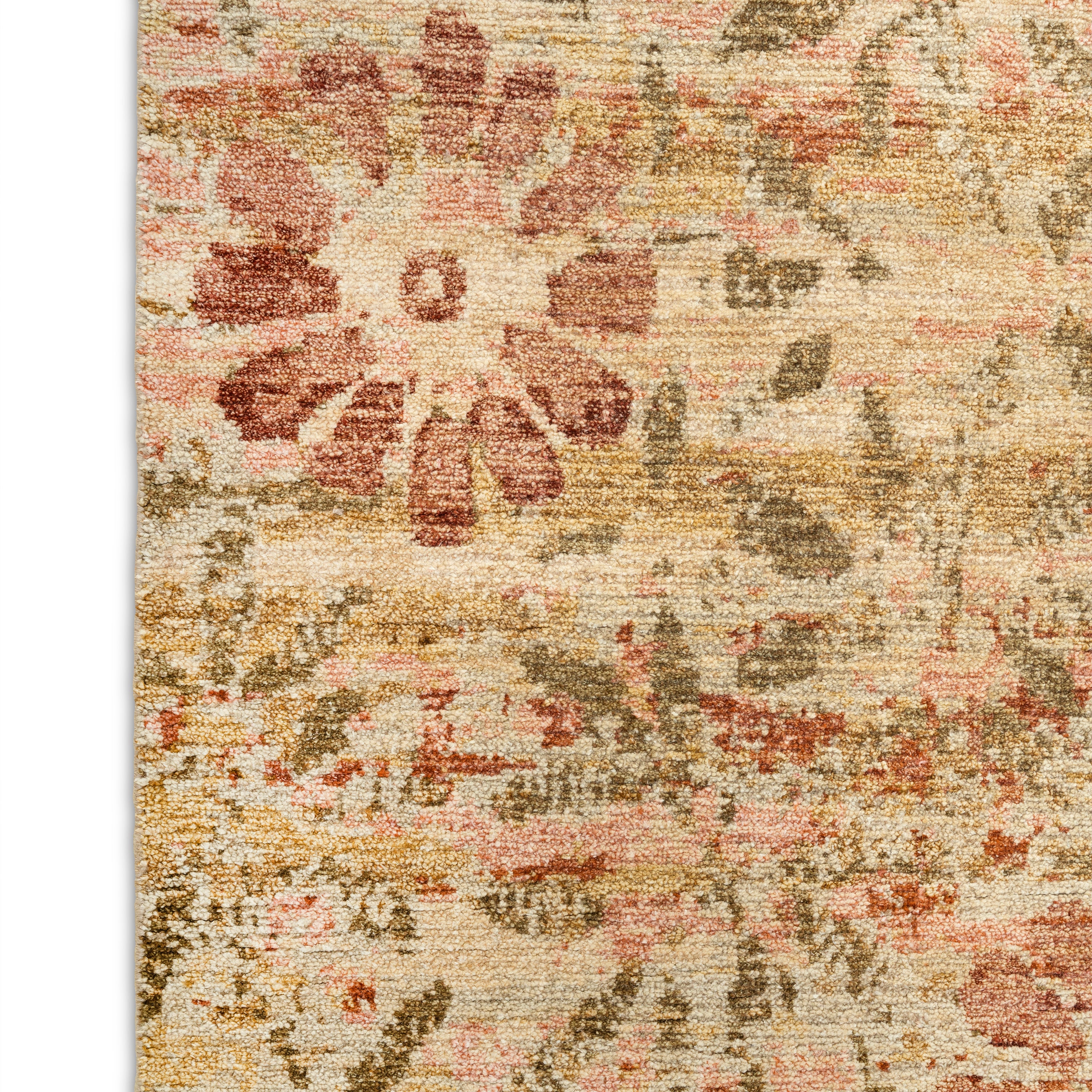 Vintage floral patterned carpet in beige, gold, gray tones.