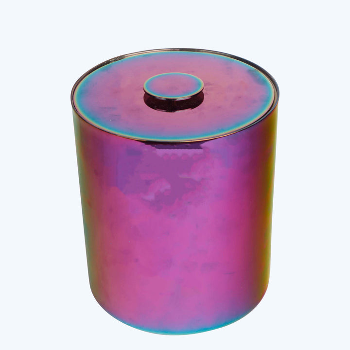 Reflective cylindrical object with iridescent surface in purple, pink, blue.