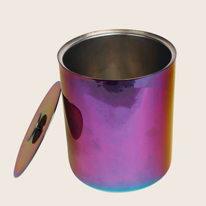Reflective cylindrical object with iridescent surface in purple, pink, blue. - hover