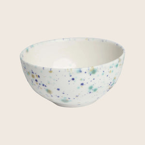 Round ceramic bowl with blue and green speckled pattern design