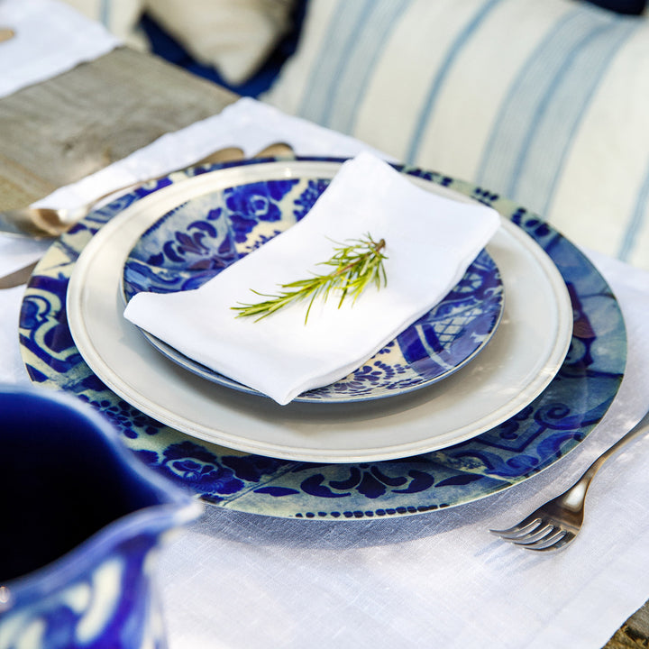 Elegantly rustic table setting with blue and white ceramic plates.