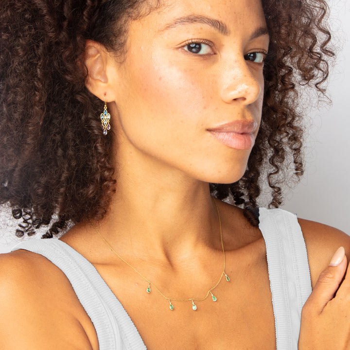 Close-up of woman in turquoise jewelry with calm expression.