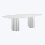 Contemporary oval table with white surface and minimalist design elements.