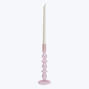 Translucent pink glass candlestick holder with bulb-like shapes, white background. - hover