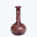 Hand-blown glass vase with red and white marbled design.