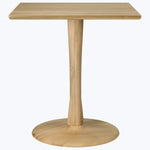 Modern, simple wooden table with tapered pedestal base, light color.
