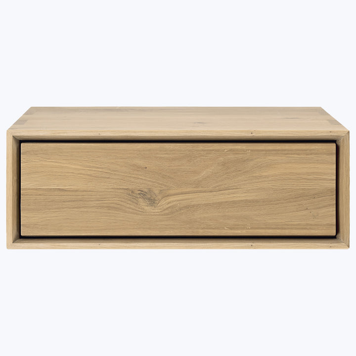 Minimalistic wooden box with single drawer, natural finish, subtle contrast.
