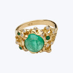 Vintage 18K gold ring with central green gemstone design