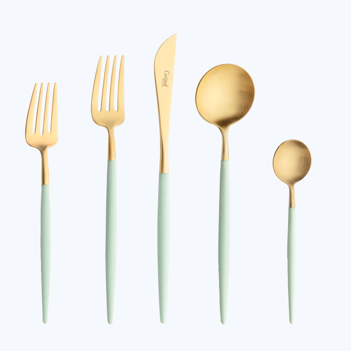 Elegant gold and mint green cutlery set on white background.