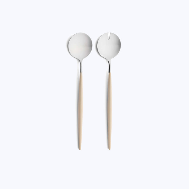 Stylish salad servers with unique bowl designs, wooden handles.