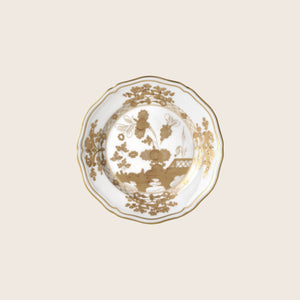 Ornate scalloped edge plate with intricate floral and garden design.