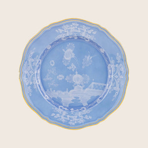 Ornate decorative plate with detailed design, gold trim and pastoral scenes