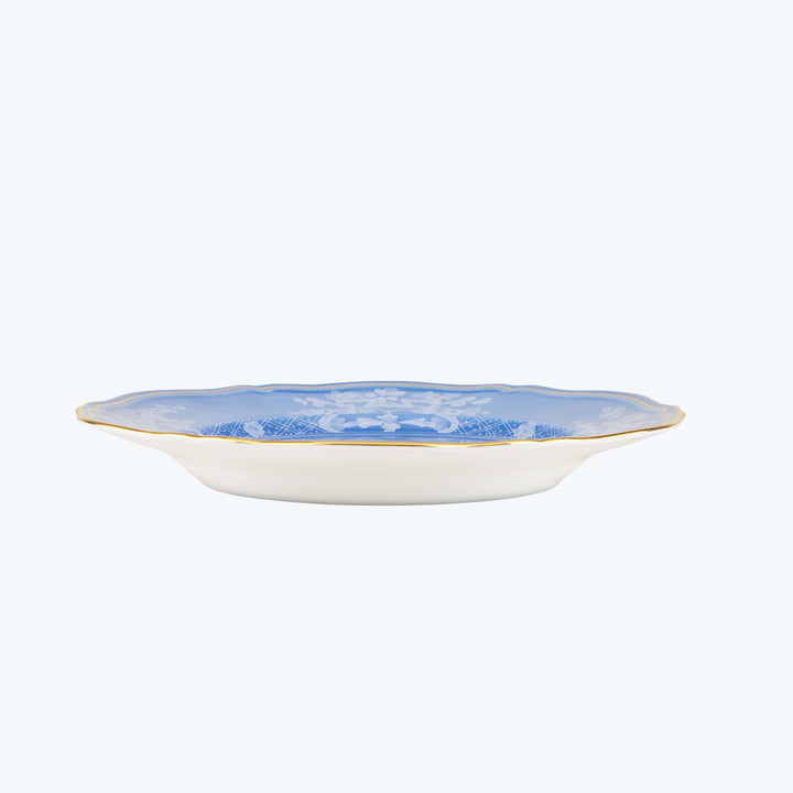 Blue and white oval ceramic plate with intricate floral design.