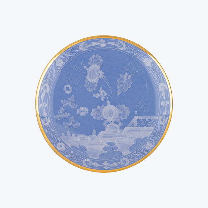 Decorative porcelain plate with blue and white floral design and gold rim