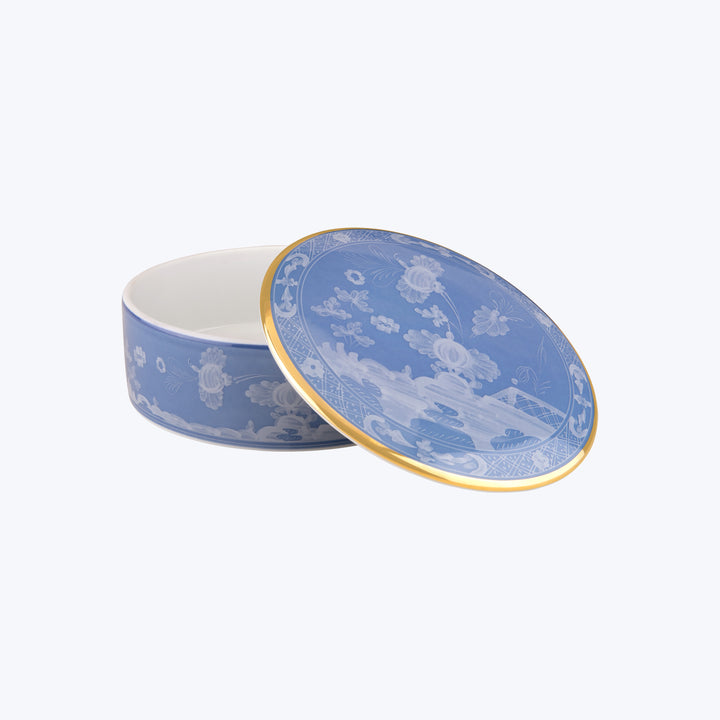 Elegant blue and white porcelain box with gold accents.