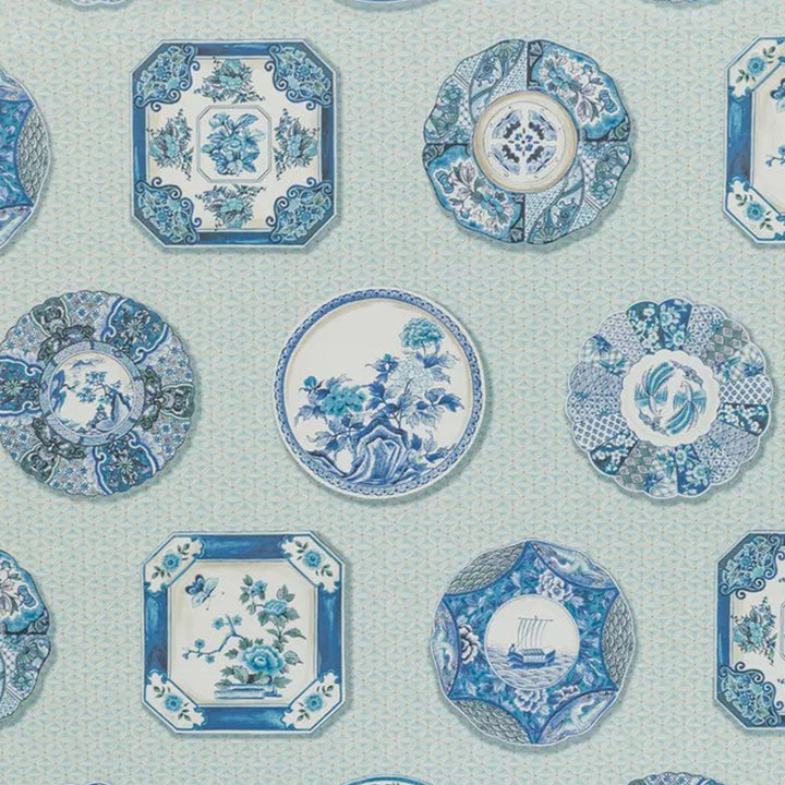 Blue and white porcelain-inspired plates with intricate floral motifs.