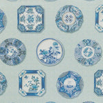 Blue and white porcelain-inspired plates with intricate floral motifs.
