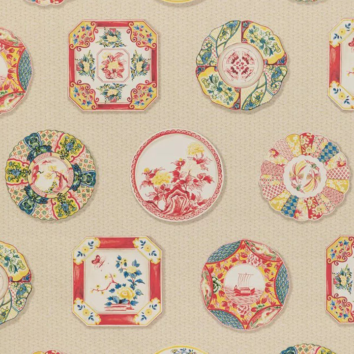 Colorful decorative plates with intricate designs on textured beige background.
