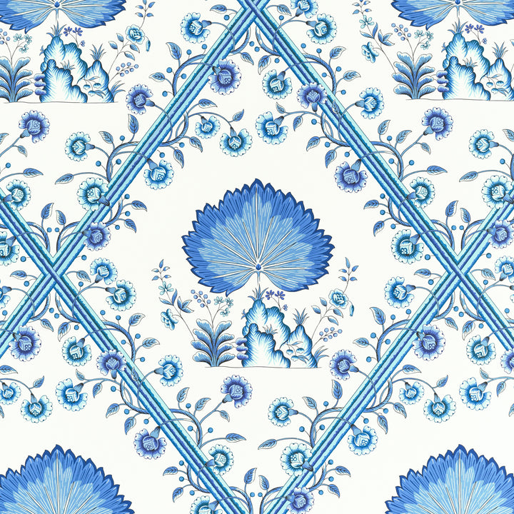 Symmetrical blue floral pattern with intricate details and ribbon-like lines.