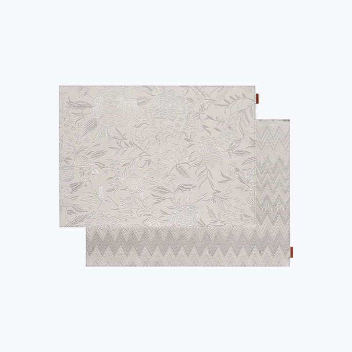 Layered floral and chevron fabric samples with elegant design style