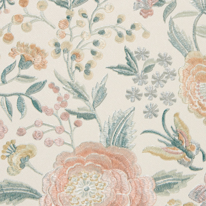 Delicate floral embroidery pattern on off-white fabric background.