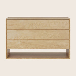 Modern minimalist dresser with natural wood finish, clean lines design.