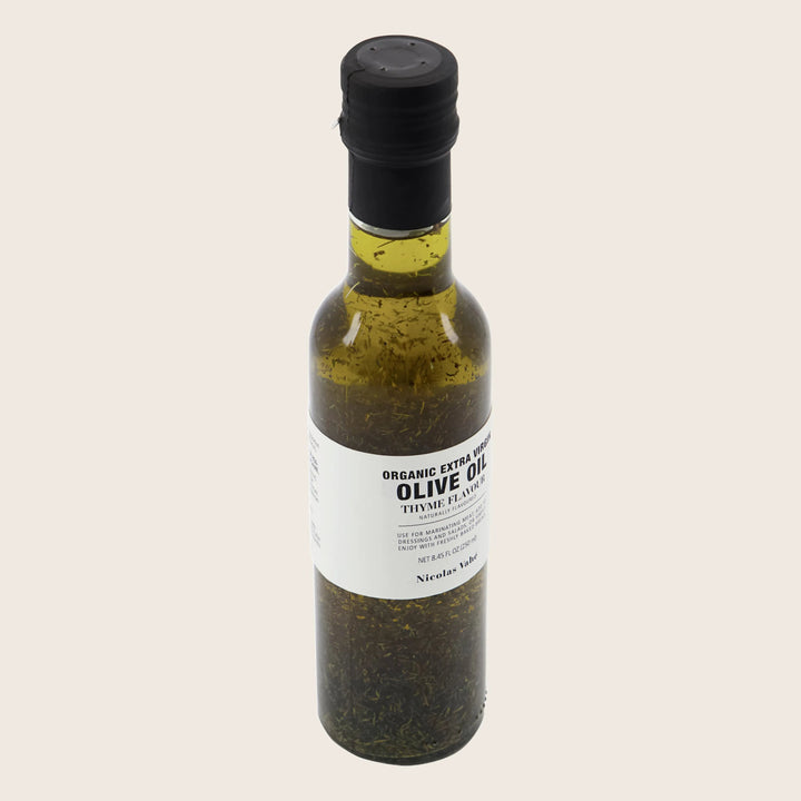 Organic thyme-infused olive oil for marinating, cooking, or dressing salads.