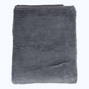 Stack of four folded gray fluffy towels in descending size - hover
