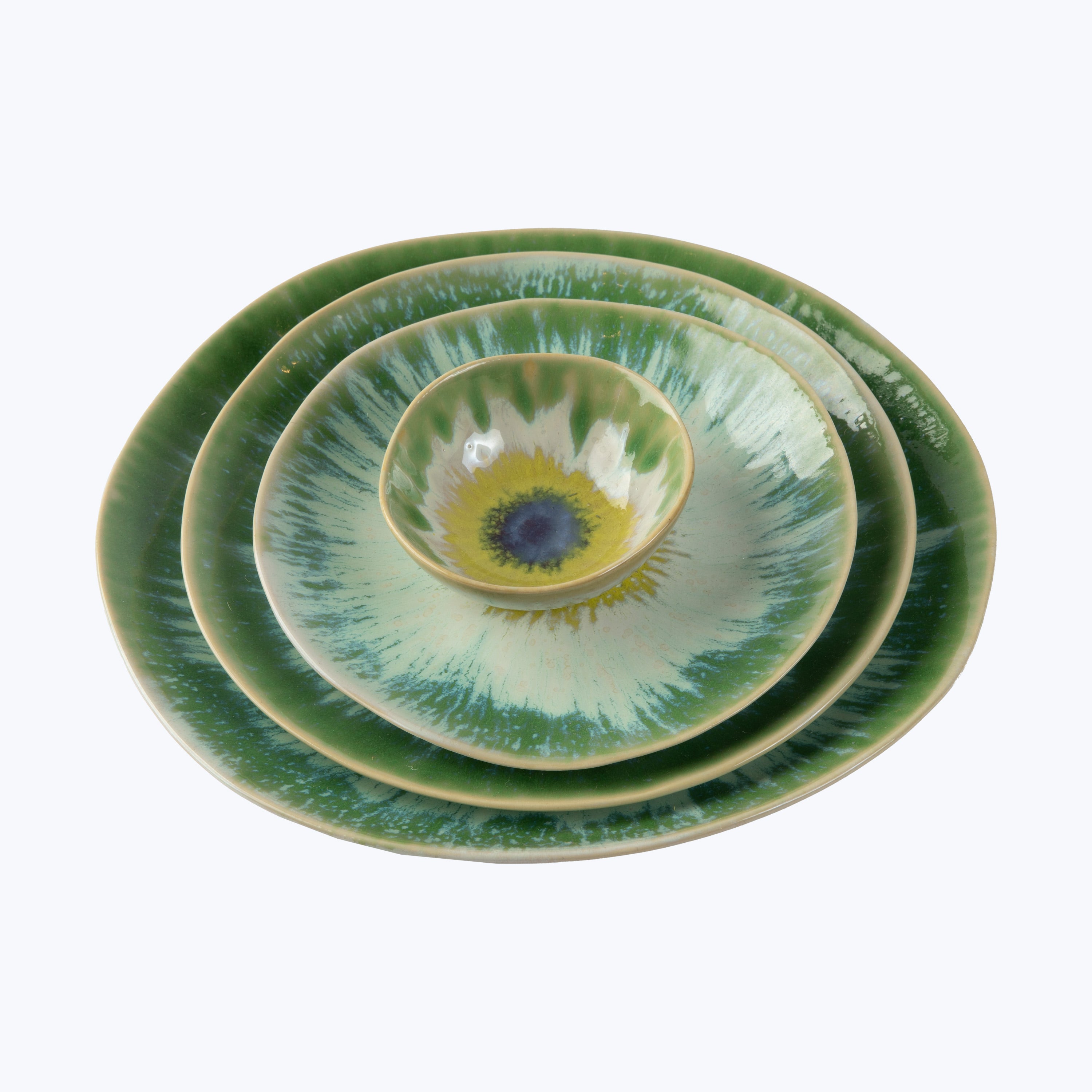 Set of three green ceramic dishes with radial gradient patterns