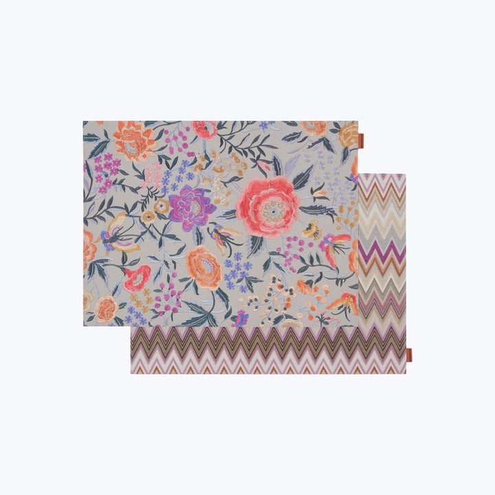 Dual-pattern fabric sample with floral and chevron designs displayed