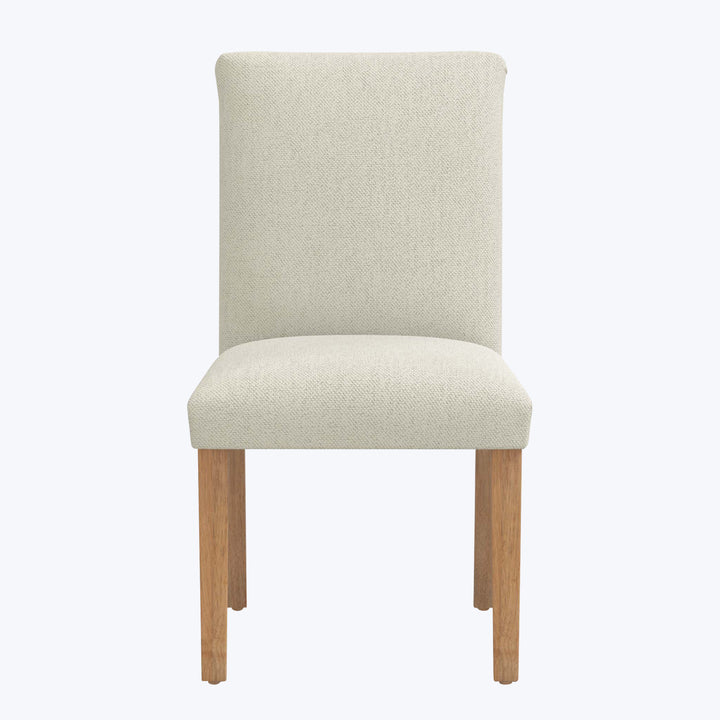 Modern dining chair with light upholstery and wooden legs design.