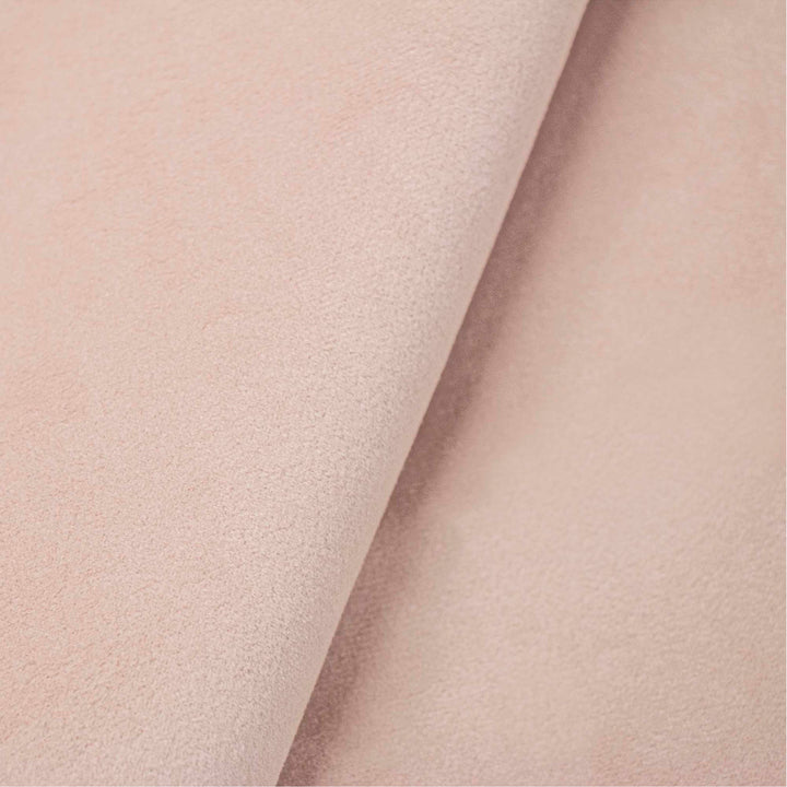 Close-up of soft, matte textured surface in neutral pink color.
